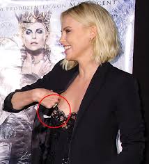 Actress Chalize Theron suffers nip slip at a movie premiere in Germany