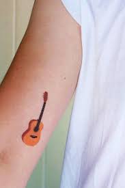 60 Inspirational Guitar Tattoos Nenuno Creative Guitar Tattoo Design Music Tattoos Guitar Tattoo