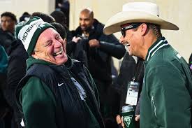 Kid Rock and Tom Izzo share a smile together at the MSU vs. Michigan  football game Saturday night. Photo by Katy Kildee, The Detroit News.