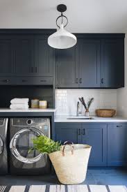 Teal, baby blue, navy blue, aquamarine…create a totally different look by changing the shades you use and the finishes of the hardware. Hale Navy By Benjamin Moore In The Mudroom At Itselectricclient Photo By Stoffer Photo Laundry Room Cabinets Laundry Room Remodel Farmhouse Laundry Room