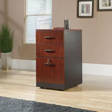 Two lateral file cabinet drawers with full extension slides to hold letter, legal or european size hanging files Sauder Via Three Drawer Pedestal Classic Cherry Soft Black Staples Ca
