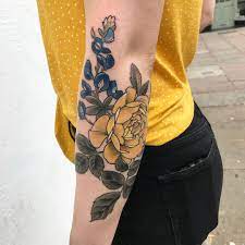 Flower tribal tattoos design on women shoulder tribal flower. Image May Contain One Or More People Yellow Flower Tattoos Yellow Rose Tattoos Daffodil Tattoo