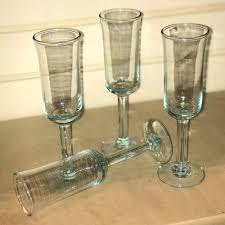 Holding the glass by the stem prevents warming the drink. Champagne Flute Glasses Recycled Glass 19cm Height Set Of 4
