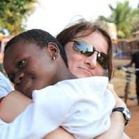 Cmdr. Alan Philippi, a U.S. Navy doctor working with the U.S. Army 354th  Civil Affairs Brigade (CAB), Special Functioning Team, Combined Joint Task  Force-Horn of Africa, listens to the breathing of a