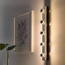 If you prefer a clean aesthetic, opt for modern bathroom vanity lights. Musik Chrome Plated Wall Lamp Ikea