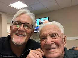 How many people are playing in the golf outing and who is the point of  contact?