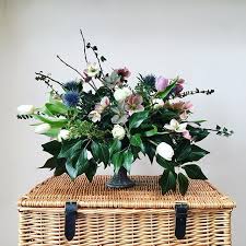 Packed with exquisite silk flowers, each handmade to replicate the real thing. Urn Arrangement Eco Friendly Winter Flowers Bristol Uk Florist Winter Floral Arrangements Winter Flowers Urn Arrangements