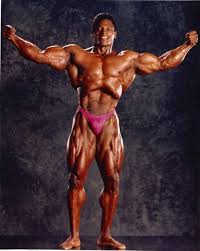The back's muscles start at the top of the back (named the cervical vertebrae) and go to the tailbone (also named the coccyx). Tony Pearson Bodybuilder Wikipedia