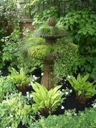 Great Planting Idea For A Shady Area Complete With Focal Point Shade Garden Traditional Landscape Shade Plants