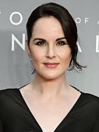Michelle Dockery attends the "Downtown Abbey: The Grand Finale" world  premiere 🩵 The actress debuted her growing baby bump