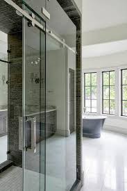 The types of bathroom doors provide beautiful look and design to the bathrooms. Walk In Shower With Glass Sliding Doors On Rails Transitional Bathroom