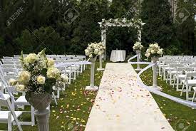 What color wedding aisle runner should i get? A White Wedding Carpet Covered In Rose Petals And The Scene Of A Recent Outdoor Garden Ceremony Stock Photo Picture And Royalty Free Image Image 7187723