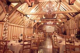 Fairy Lights Wrapped Around The Barn Beams Create A Magical Effect Winterwedding Sussex Countryweddin Barn Wedding Venue Barn Wedding Barn Wedding Reception