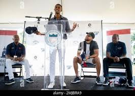 Howard student Otis Ferguson speaks during a news conference as Howard  University Athletic Director Kery Davis, left, Howard University president  Wayne Frederick, right, and Golden State Warriors guard Stephen Curry look  on
