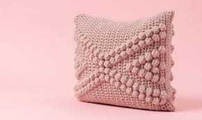 The pattern includes instructions for creating motifs without intarsia and fabric covered buttons to embellish the. Crochet Pillow Covers That Fit And Function Craftsy