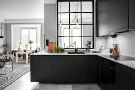 The wood kitchen island countertop, desaturated green/gray cabinets, oversized farmhouse sink, and black paneled window frames give this space a laid back feel. Kitchen Cabinets Shop Online In Stock Kitchen Cabinets Free Shipping