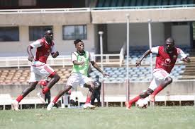 Harambee stars' hassan abdalla (l) shields the ball from isaac muleme of uganda cranes during a 2022 world cup qualifier match at nyayo . Harambee Stars Update Francis Kimanzi Eyes Victory Against Zambia