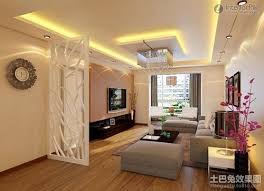 This lighting option is a foolproof way to create a focal point in your living room, and a modern mobile design (like the one pictured) sheds light while adding visual interest to your space. Living Room Lighting Ideas Ceiling Spot Ceiling Design Living Room Living Room Ceiling Ceiling Design Modern