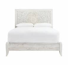 Charming whitewashed finish sets a foundation for a room bursting with personality. Signature Design Paxberry Whitewash Wood Queen Panel Bed By Ashley