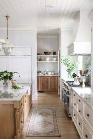 In the last 20 years, they went out of style due to a glut of bad builder's grade work. White And Brown Kitchen With Walk In Pantry Transitional Kitchen