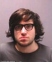 American Nicholas Rossi who faked his own death and fled to Scotland to  escape rape charges is wheeled into court to face trial