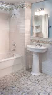 This contemporary master bath is elegant and inviting with an airy, sandy tile backsplash, blonde double vanity and natural stone floors. Classic Bathroom Tile