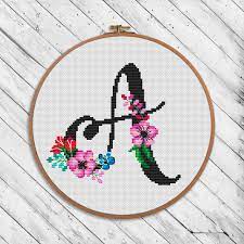 ⋒ color image of the finished design ⋒ instruction and list of dmc colors ⋒ color symbol chart spread over several a4 sheets for printing ⋒ black and white symbol this pdf counted cross stitch pattern available for instant download. Black Floral Alphabet A Cross Stitch Pattern Botanical Cross Stitch Letters Stitch Patterns Cross Stitch Alphabet