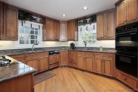 Traditional Medium Wood Brown Kitchen Cabinets I Like These Cabinets With That Floor Kitchen Design Modern Wood Kitchen Kitchen Cabinets