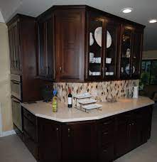 Starmark Cherry Cabinets With Mocha Stain With Caesarstone Dreamy Marfil Quartz And Marble Mosaic Kitchen Cabinets In Bathroom Kitchen Remodel Cherry Cabinets