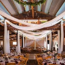Go For Grandeur By Draping White Chiffon Around The Venue The Long Flowing Material Will Show Off T Barn Wedding Decorations Wedding Ceiling Wedding Draping