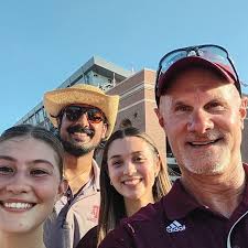 Associate Dean for Student Services Don Curtis and public health students  Varun Singh, Presley Reilley and Sophia Duty cheered the Aggies to a win  over Bowling Green at this past Saturday's football