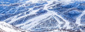 The town is surround by high mountains, similar to the alps, and has a river, hemsila going thru the valley. Ski Slopes In Hemsedal Stock Photo