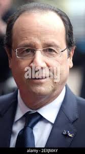French President Francois Hollande (C), Netherlands' King Willem-Alexander  (L) and Queen Maxima stand in front of the two Rembrandt's paintings during  their visit to the Louvre Museum in Paris, France