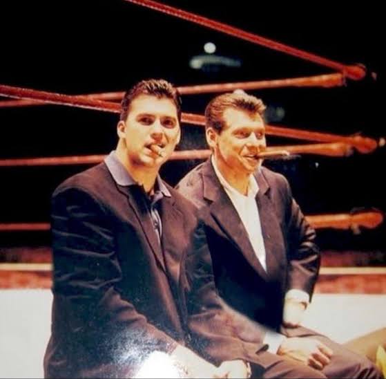 Old pic of Shane and Vince McMahon at a WWE house show, smoking cigars,  while sitting on the ring : r/SquaredCircle
