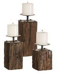 Adding a little rustic flare to your décor may be just the extra it would even carry through well into the winter with a little added foliage. Rustic Repurpose Recycled Candleholders Rustic Candleholders Wooden Candle Holders Wood Candle Holders