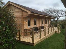 With panoramic views over the lake, private parkin. Log Cabins By South West Log Cabins