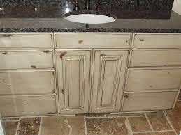 If you want more texture on the cabinets and in the floors without looking too busy, a great combination is stained knotty alder cabinet material paired with wood flooring that has a lot of color variation such as natural red or white oak or hickory. Antique White Knotty Alder Cabinets Alder Cabinets Antique White Kitchen