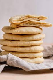Put 2 pita rounds at a time on the hot pizza stone and bake for 3 to 4 minutes, or until the bread puffs up like a balloon and is. Homemade Pita Bread Brown Eyed Baker