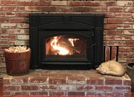 Behind the side curtain or access panel; Quadra Fire Voyager Wood Burning Fireplace Insert Closeup Auburn Home Energy Center