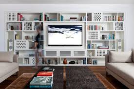 This Modern Apartment Has A Custom Designed Shelving Unit In The Living Room That Shelving Units Living Room Living Room Shelves Built In Shelves Living Room