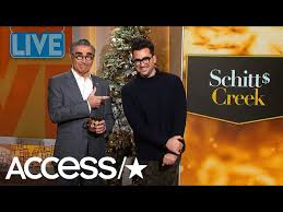 After enrolling in emerson college in boston, dan began performing at open mics and other strange venues—where people were more focused on their beer than what the wannabe comics were saying. The Untold Truth Of Eugene Levy S Wife Deborah Divine