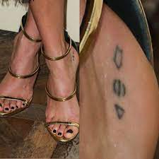 She met her in russia. Nikki Reed Symbol Foot Tattoo Steal Her Style