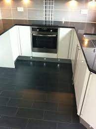 This kitchen worktop comes in a stone grey and has a shiny finish to it. Black Granite Worktop Grey And Black Tiles White Gloss Units Black Tiles Kitchen White Gloss Kitchen Black Floor Tiles