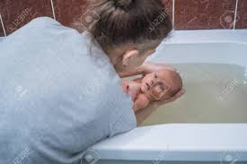 We look forward to welcoming you to our lovely little wellbeing sanctuary in the heart of bath city. Woman Bathing Baby In The Bath Baby Massage In Warm Water Recovery Stock Photo Picture And Royalty Free Image Image 115590165