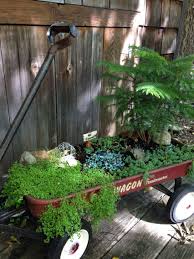 My Upcycled Fairy Garden In A Wagon Using A No Fishing Sign From An Old Gold Fish Bowl Corinth Mint A Clearance Tree Fro Goldfish Pond Fairy Garden Fish Pond