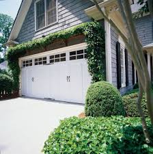 Dress Up Your Garage Doors With New Decorative Hardware And Faux Windows Also Love The Ivy Garage Pergola Garage Door Design Pergola Patio