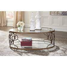 Naturally chic with a touch of urban industrial flair, this coffee table beautifully accentuates your clean, contemporary sense of taste. Ashley Furniture Fraloni Bronze Finish Oval Metal Coffee Table With Glass Top Walmart Com Walmart Com
