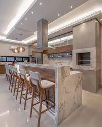 Espaco Gourmet Neutro E Amadeirado Com Ilha E Mesa Acoplada Em Marmore Matarazzo Design De Cozinha Cozinhas Modernas Decoracao De Varanda Gourmet