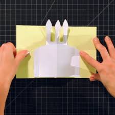 Fold on all the creases and fold the cake parts into the center of the card as shown above. How To Make A Birthday Cake Pop Up Card Howcast