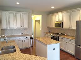 Apply the paint start by painting the inside edges and openings of the face frames, then the outer cabinet sides, and finally the face frame fronts. Painting Kitchen Cabinets Before After Mr Painter Paints Kitchen Cabinets